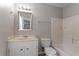Standard bathroom with shower-tub combination, toilet, vanity, and mirror at 5292 Mountain Village Ct, Stone Mountain, GA 30083