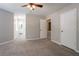 Bright bedroom with carpet, ceiling fan, ensuite bathroom, and ample closet space at 5292 Mountain Village Ct, Stone Mountain, GA 30083