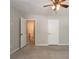 Spacious bedroom with carpet, neutral walls, and access to adjacent rooms at 5292 Mountain Village Ct, Stone Mountain, GA 30083