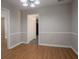 Dining room with wood floors and access to kitchen and hallway at 5292 Mountain Village Ct, Stone Mountain, GA 30083