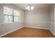 Dining room features wood floors, chair rail, and window at 5292 Mountain Village Ct, Stone Mountain, GA 30083