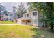Inviting two-story home with a stone-accented porch, attached garage, and well-maintained lawn at 5292 Mountain Village Ct, Stone Mountain, GA 30083