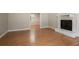 Spacious living room showcasing hardwood floors, a charming fireplace, and an open layout at 5292 Mountain Village Ct, Stone Mountain, GA 30083