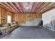 Finished basement with workout room, concrete foundation, and open ceilings at 6370 Stillwood Ln, Cumming, GA 30041