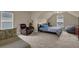 Spacious bedroom with two windows and a comfortable sitting area at 6370 Stillwood Ln, Cumming, GA 30041