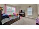 Bedroom with plenty of natural light and fun decor at 6370 Stillwood Ln, Cumming, GA 30041