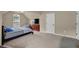 Cozy bedroom with a bed, television, and comfortable seating at 6370 Stillwood Ln, Cumming, GA 30041