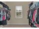 Walk-in closet with an abundance of storage space and natural light at 6370 Stillwood Ln, Cumming, GA 30041