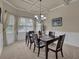 This dining room features bright windows and neutral walls, creating a warm and inviting space at 6370 Stillwood Ln, Cumming, GA 30041