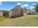 Attractive two-story home with brick and siding exterior, features a well maintained lawn at 6370 Stillwood Ln, Cumming, GA 30041