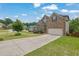 Beautiful two-story home features a two-car garage and a long driveway at 6370 Stillwood Ln, Cumming, GA 30041