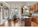Lovely eat-in kitchen featuring stainless steel appliances, hardwood floors, and granite countertops at 6370 Stillwood Ln, Cumming, GA 30041