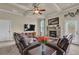 Inviting living room with a stone fireplace and coffered ceiling detail at 6370 Stillwood Ln, Cumming, GA 30041