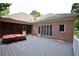 Backyard deck with a hot tub, brick house and screened in porch perfect for outdoor living at 830 Cramac Dr, Lawrenceville, GA 30046