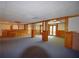 Large basement with paneling, brick accents, and walkout entrance at 830 Cramac Dr, Lawrenceville, GA 30046
