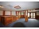 Spacious basement features a large wet bar, wood trim and lots of space for entertaining and recreation at 830 Cramac Dr, Lawrenceville, GA 30046