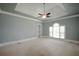 Bright bedroom featuring large windows that let in natural light, neutral walls, and plush carpeting, offering a comfortable living space at 830 Cramac Dr, Lawrenceville, GA 30046