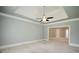 Primary bedroom with tray ceilings, ceiling fan, and neutral decor at 830 Cramac Dr, Lawrenceville, GA 30046