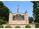 Entrance sign for Cramac Plantation featuring stone pillars and lush landscaping at 830 Cramac Dr, Lawrenceville, GA 30046