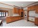 Traditional kitchen featuring wooden cabinets, white countertops, and stainless steel appliances at 830 Cramac Dr, Lawrenceville, GA 30046
