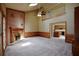 Spacious living room with a brick fireplace, carpet flooring, and an open doorway at 830 Cramac Dr, Lawrenceville, GA 30046