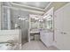 Bright bathroom featuring granite countertops, a glass-enclosed shower, and ample cabinet space at 120 Forest Breeze Cv, Alpharetta, GA 30022