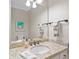 Clean bathroom featuring a granite countertop sink, ample lighting, and modern fixtures at 120 Forest Breeze Cv, Alpharetta, GA 30022