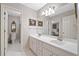 Bathroom with a double sink vanity and tiled floors at 120 Forest Breeze Cv, Alpharetta, GA 30022