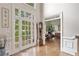 Bright foyer with hardwood floors, double doors, and high ceilings at 120 Forest Breeze Cv, Alpharetta, GA 30022