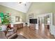 Spacious living room with hardwood floors, neutral walls, and comfortable seating arrangements at 120 Forest Breeze Cv, Alpharetta, GA 30022