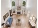 Grand living room with a fireplace, hardwood floors, and an open layout design at 120 Forest Breeze Cv, Alpharetta, GA 30022