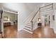 Grand staircase with hardwood floors and a view to the living room at 120 Forest Breeze Cv, Alpharetta, GA 30022