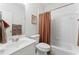 A full bathroom with a shower and tub combination and single sink vanity at 1055 Beacon Hill Xing, Alpharetta, GA 30005