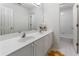 Bathroom with a double sink vanity, a large mirror, and a tile floor at 1055 Beacon Hill Xing, Alpharetta, GA 30005