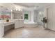 Bright bathroom with a soaking tub, glass shower, and white cabinets, offering a spa-like experience at 1055 Beacon Hill Xing, Alpharetta, GA 30005