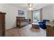 Bedroom with a wooden crib, blue chair, and ottoman, providing a comfortable and stylish setting at 1055 Beacon Hill Xing, Alpharetta, GA 30005