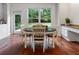 A cozy breakfast nook with hardwood floors and natural light at 1055 Beacon Hill Xing, Alpharetta, GA 30005