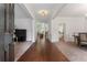 A home's grand foyer showcasing the hardwood floors and natural light at 1055 Beacon Hill Xing, Alpharetta, GA 30005