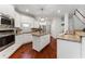 Gourmet kitchen featuring stainless steel appliances, granite countertops, and a center island at 1055 Beacon Hill Xing, Alpharetta, GA 30005