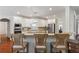 An open kitchen with granite countertops and seating at the breakfast bar at 1055 Beacon Hill Xing, Alpharetta, GA 30005