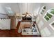 High angle view of living room with fireplace, built ins, and large windows at 1055 Beacon Hill Xing, Alpharetta, GA 30005