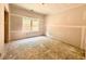 Bedroom features drywall ready for paint and a large window providing natural light and backyard views at 133 West Lake Blvd, Carrollton, GA 30116
