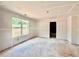 Spacious living room featuring drywall, ready for personalization with a large window for natural light at 133 West Lake Blvd, Carrollton, GA 30116