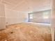 Expansive living room featuring fresh drywall, windows, and abundant space for future customization at 133 West Lake Blvd, Carrollton, GA 30116