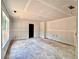 A bright living room featuring a large window, drywall, and ample space, awaiting its new design at 133 West Lake Blvd, Carrollton, GA 30116