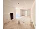 A large living room area featuring sheetrock walls and ceiling, awaiting a homeowner's creative design at 133 West Lake Blvd, Carrollton, GA 30116