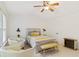 Comfortable bedroom showcasing neutral tones, ceiling fan, and stylish decor at 2457 Birkhall Way # 2457, Lawrenceville, GA 30043