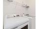 Convenient laundry area with modern washer and dryer and overhead storage at 2457 Birkhall Way # 2457, Lawrenceville, GA 30043
