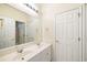 Bright bathroom featuring a double sink vanity, large mirror, and a separate door to the toilet and shower at 3753 Honey Pot Ne Way, Marietta, GA 30066