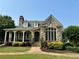 Charming stone home featuring a beautifully landscaped yard, covered porch, and multi-pane windows at 3753 Honey Pot Ne Way, Marietta, GA 30066